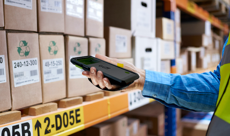 Worker scanning a pallet with an Android handheld scanner